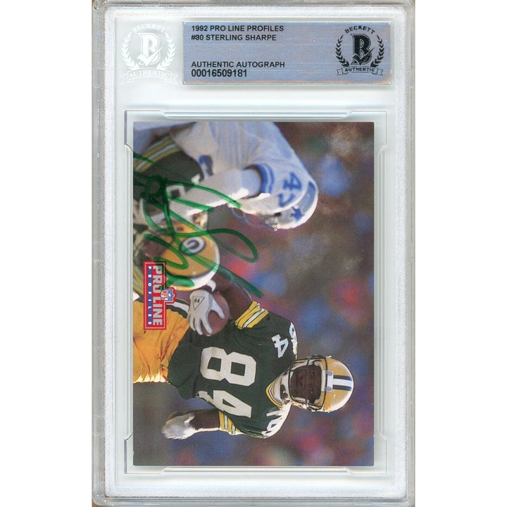 Footballs- Autographed- Sterling Sharpe Green Bay Packers Signed 1992 Pro Line Profiles Trading Card Beckett Authenticated Auto Slab Front