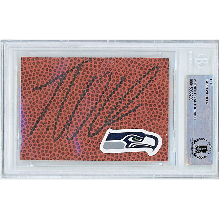 Footballs- Autographed- Tariq Woolen Seattle Seahawks Signed Football Signature Cut Beckett Authentic Auto Slab Front