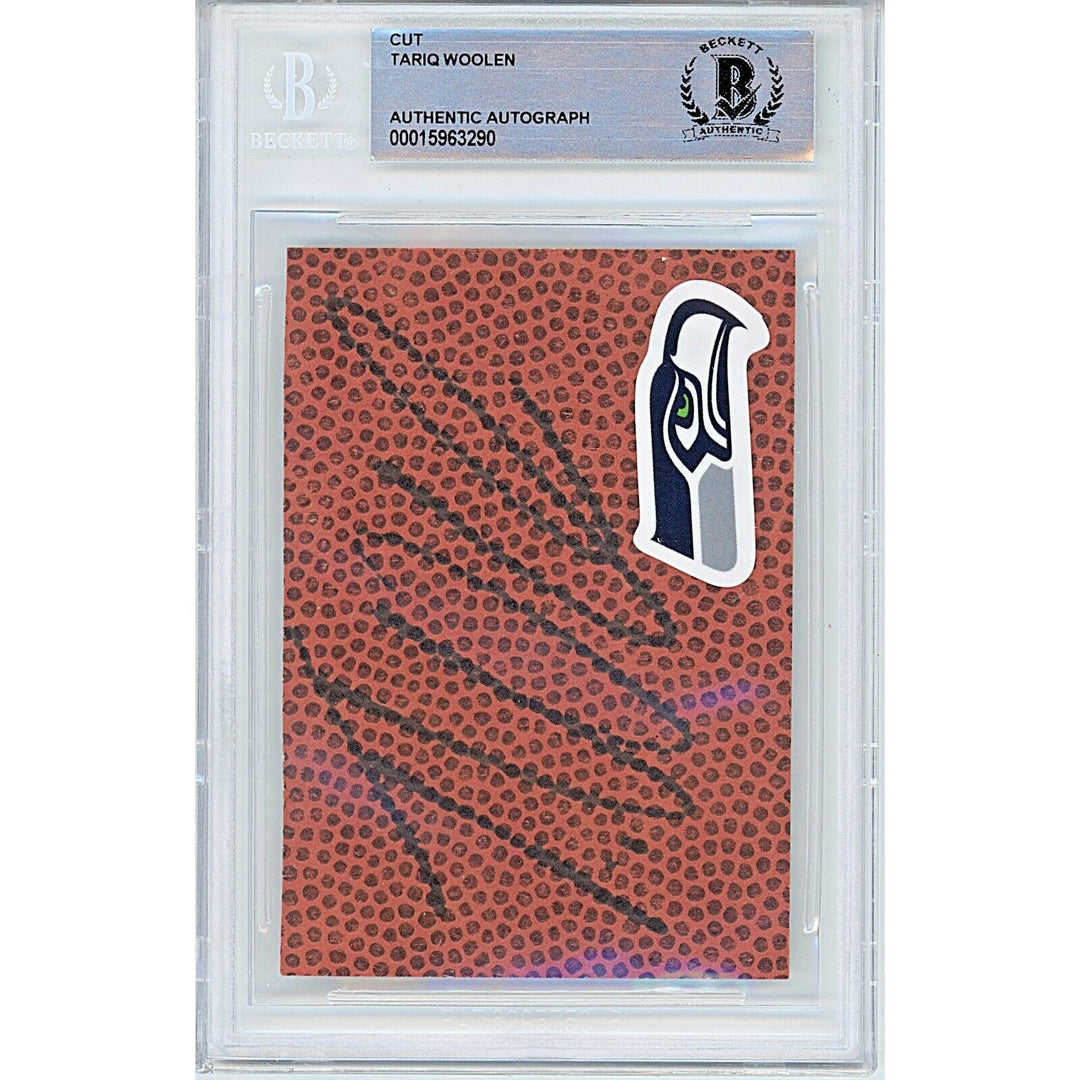Footballs- Autographed- Riq Woolen Seattle Seahawks Signed Football Signature Cut Beckett Authentic Auto Slab Front