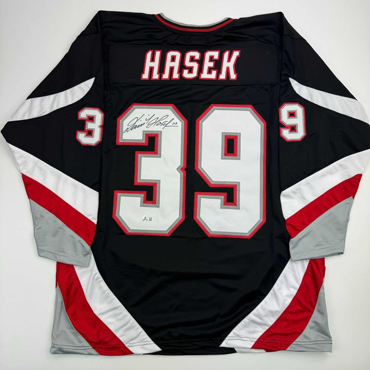 Autographed/Signed Dominik Hasek Buffalo Black Jersey Beckett BAS COA