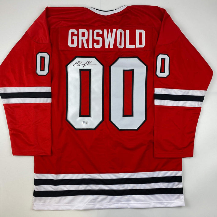 Autographed/Signed Chevy Chase Clark Griswold Vacation Red Jersey Beckett COA