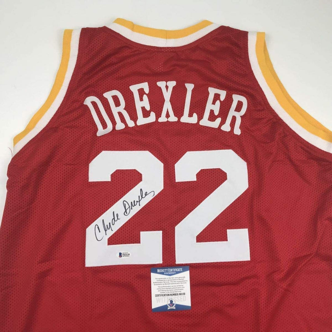 Autographed/Signed Clyde Drexler Houston Red Basketball Jersey Beckett BAS COA