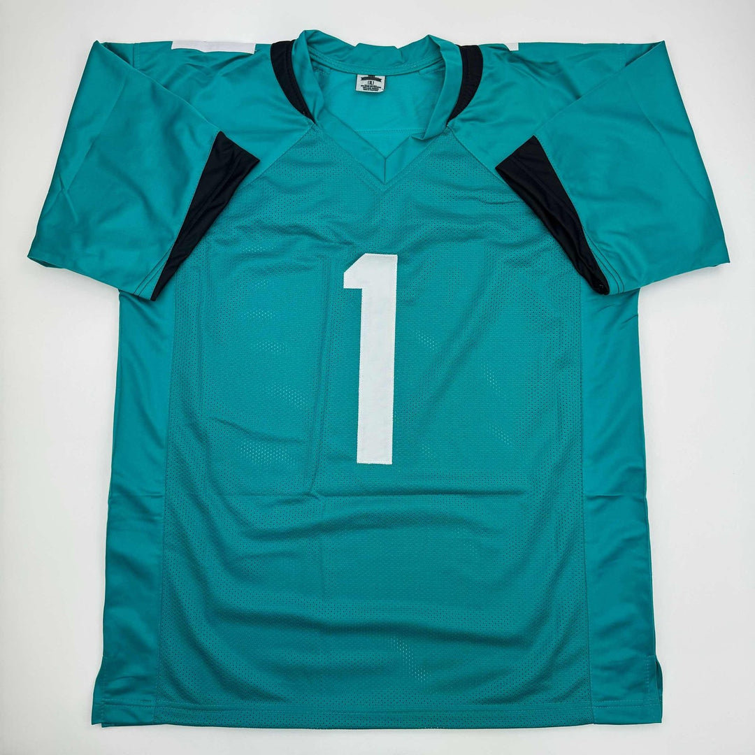 Autographed/Signed Travis Etienne Jr. Jacksonville Teal Jersey Beckett COA