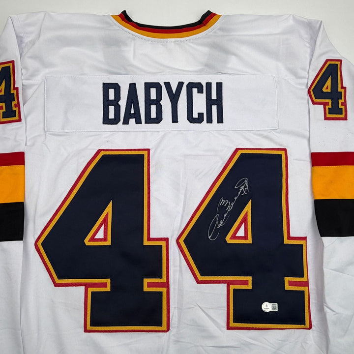Autographed/Signed Dave Babych Winnipeg White Retro Jersey Beckett BAS COA