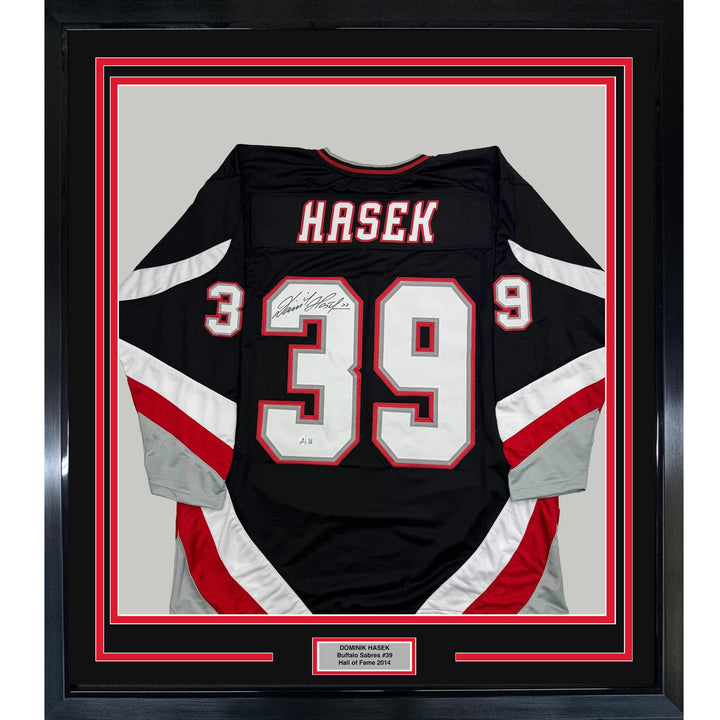 Framed Autographed/Signed Dominik Hasek 35x39 Buffalo Black Jersey BAS COA