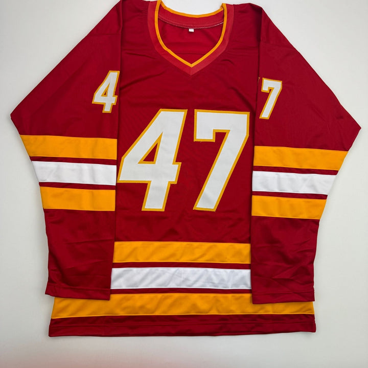 Autographed/Signed Connor Zary Calgary Red Hockey Jersey Beckett BAS COA