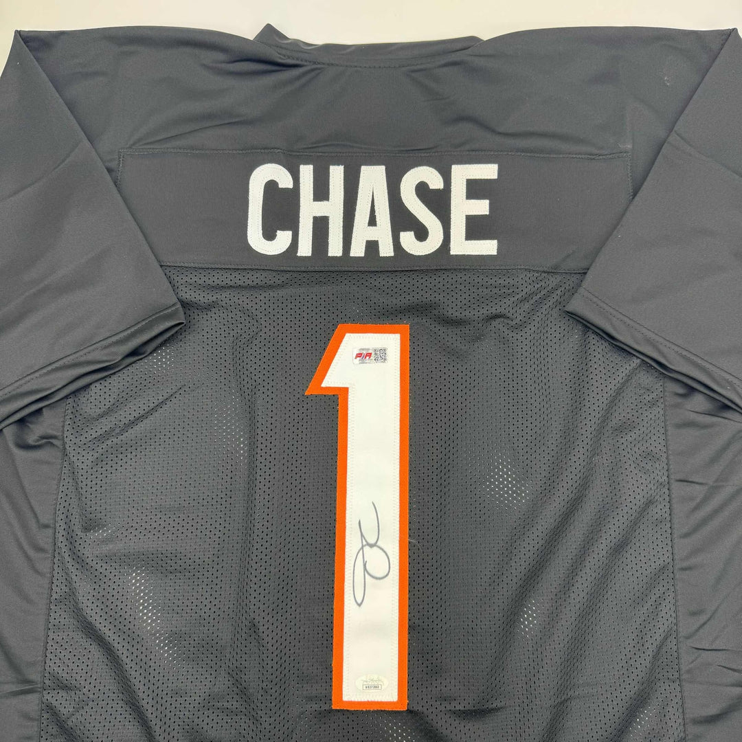 Autographed/Signed Ja'Marr Chase Cincinnati Black Football Jersey Beckett COA