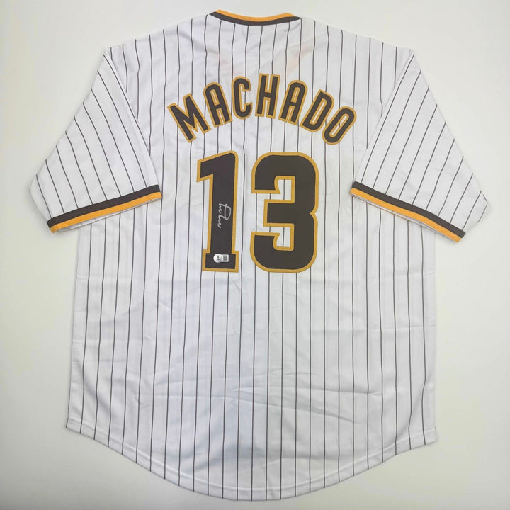 Autographed/Signed MANNY MACHADO San Diego Pinstripe Jersey Beckett COA