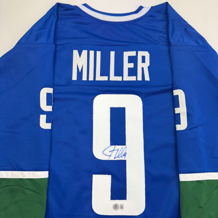 Autographed/Signed JT Miller Vancouver Blue Hockey Jersey Beckett BAS COA