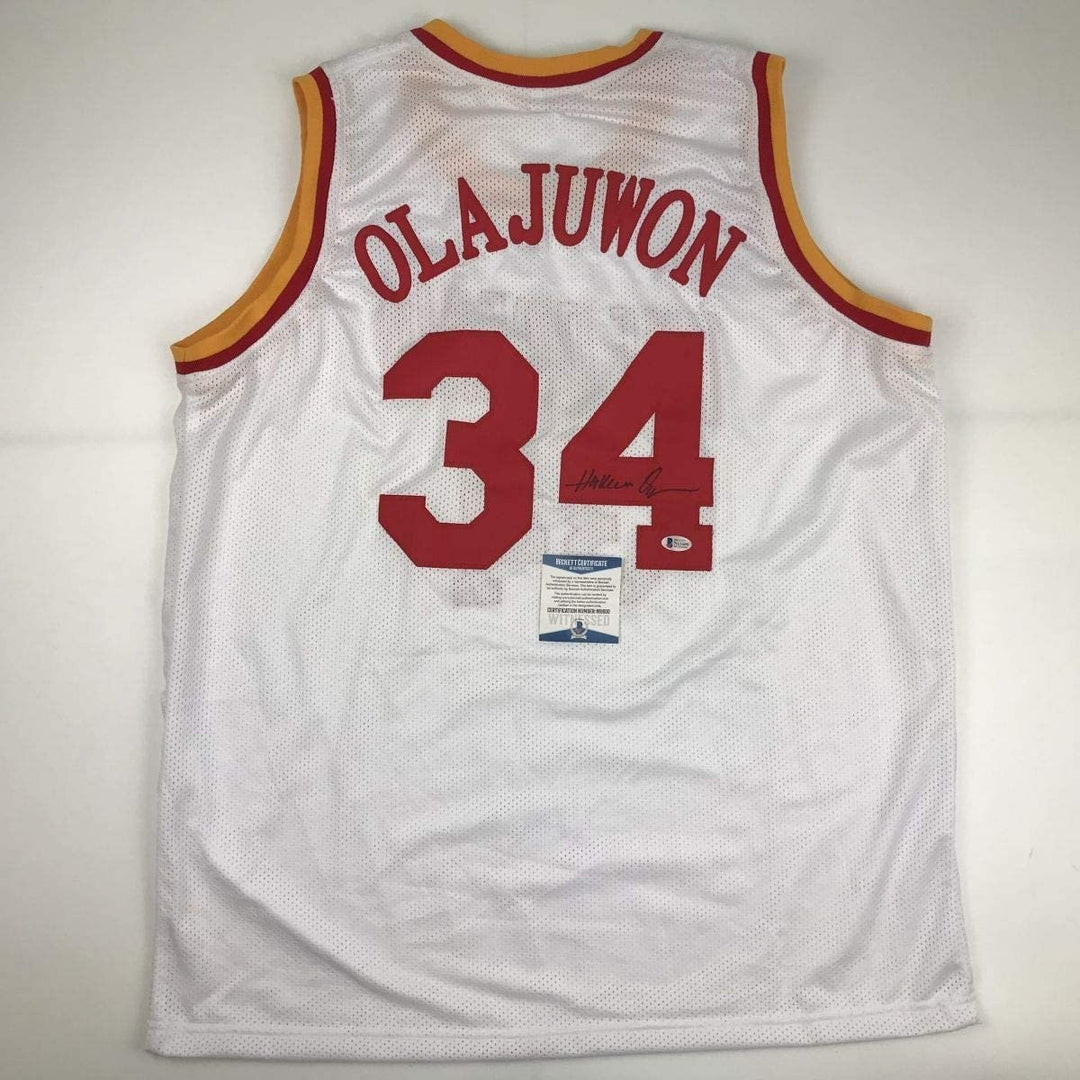 Autographed/Signed Hakeem Olajuwon Houston White Jersey Beckett BAS COA