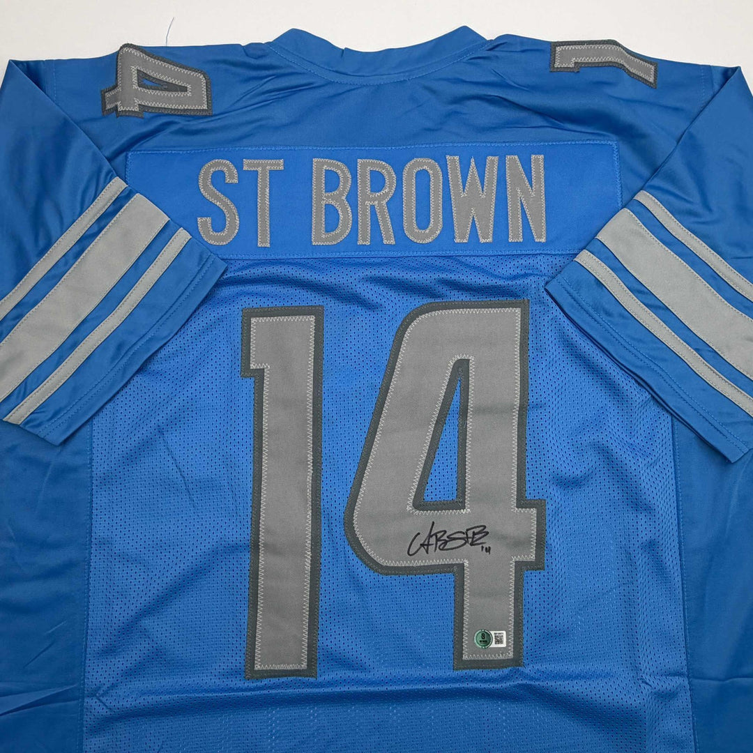 Autographed/Signed Amon-Ra St. Brown Detroit Blue Jersey Beckett BAS COA