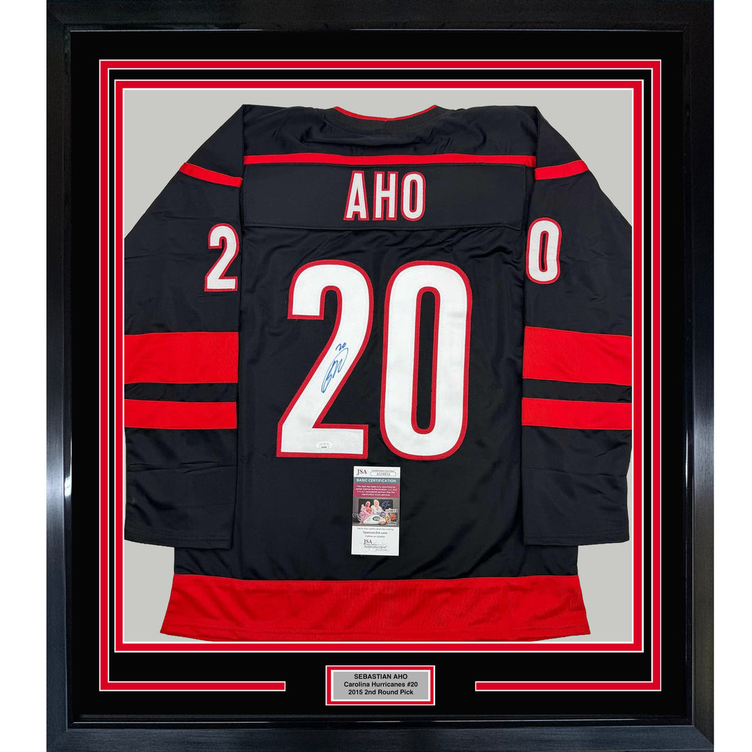 Framed Autographed/Signed Sebastian Aho 35x39 Carolina Black Jersey JSA COA