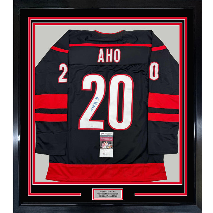 Framed Autographed/Signed Sebastian Aho 35x39 Carolina Black Jersey JSA COA