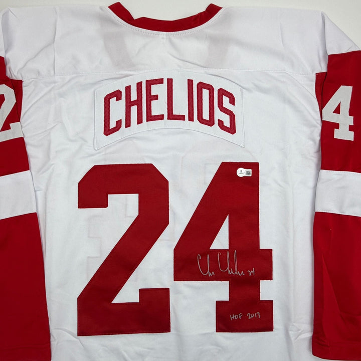 Autographed/Signed Chris Chelios Detroit White Hockey Jersey Beckett COA