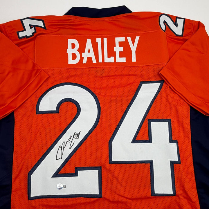 Autographed/Signed Champ Bailey Denver Orange Football Jersey Beckett COA