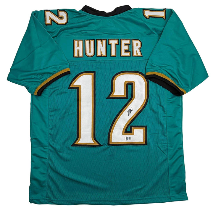Autographed/Signed Travis Hunter Jacksonville Teal Retro Jersey Beckett BAS COA