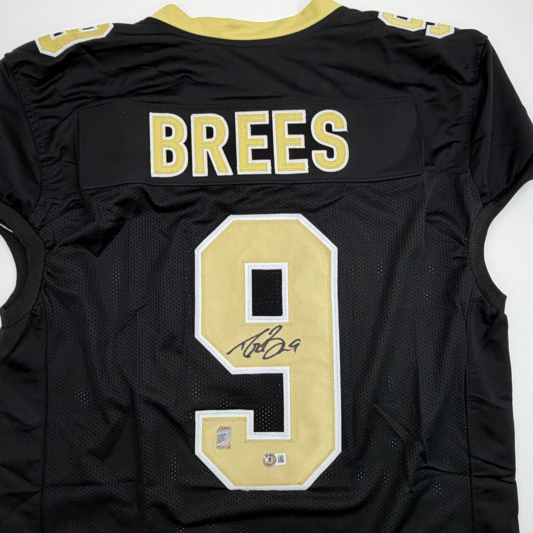Autographed/Signed Drew Brees New Orleans Black Pro Cut Jersey Beckett COA