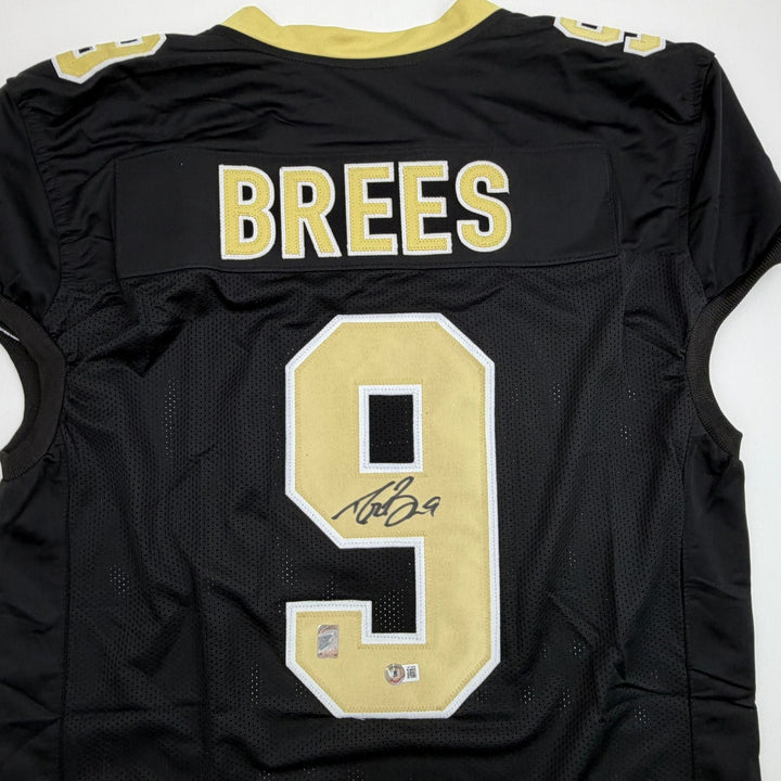 Autographed/Signed Drew Brees New Orleans Black Pro Cut Jersey Beckett COA