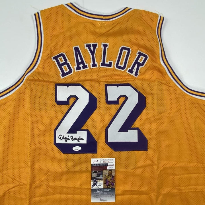 Autographed/Signed ELGIN BAYLOR Los Angeles Yellow Jersey JSA COA