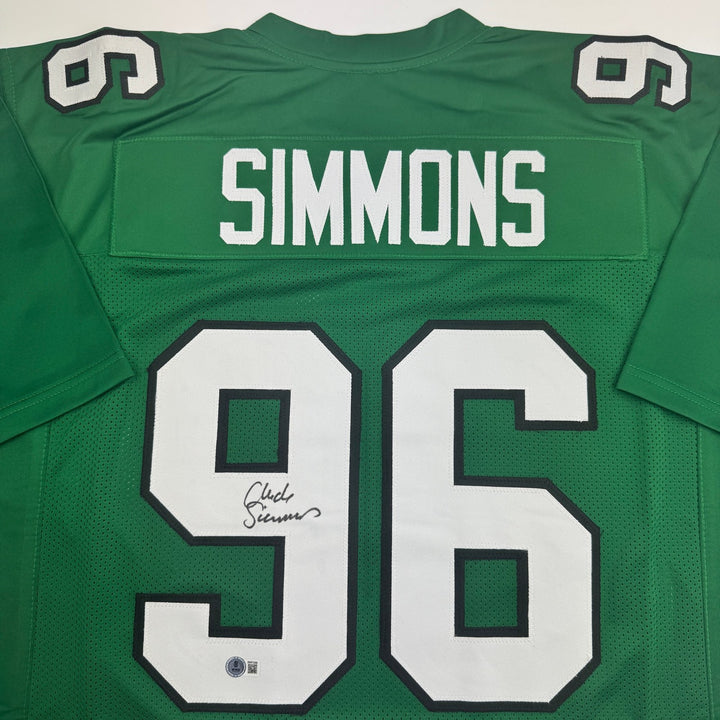 Autographed/Signed Clyde Simmons Philadelphia Green Football Jersey Beckett COA
