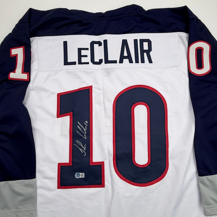 Autographed/Signed John LeClair United States USA White Jersey Beckett COA