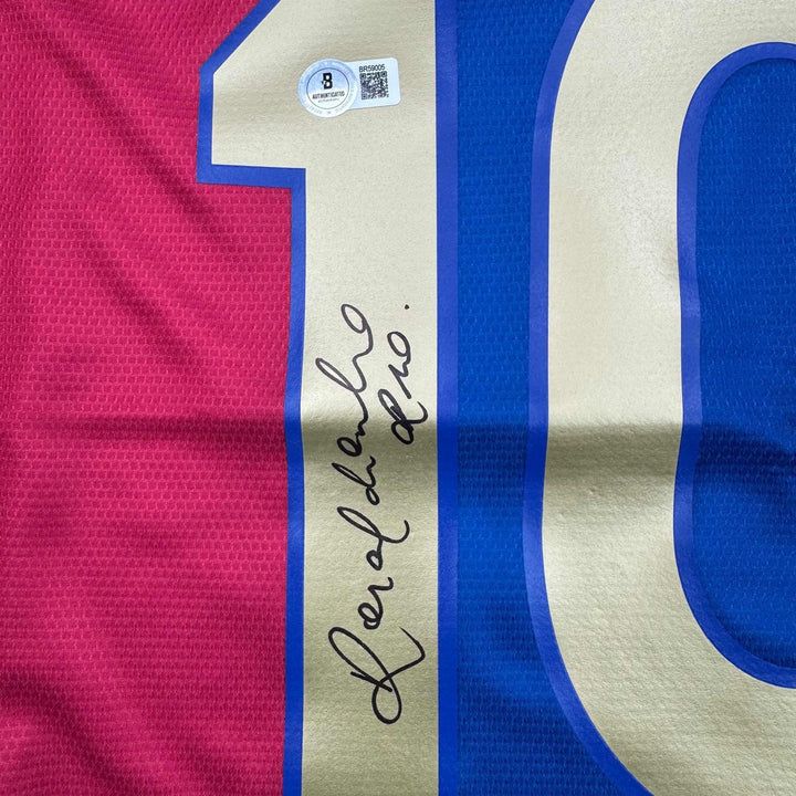 Autographed/Signed Ronaldinho Barcelona Blue/Red Jersey Beckett BAS COA