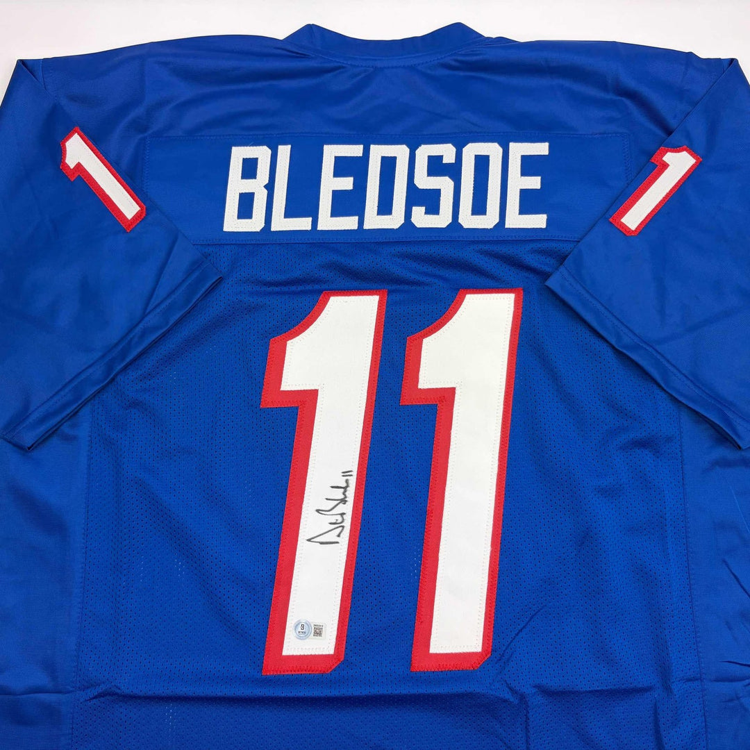 Autographed/Signed Drew Bledsoe New England Blue Jersey Beckett BAS COA