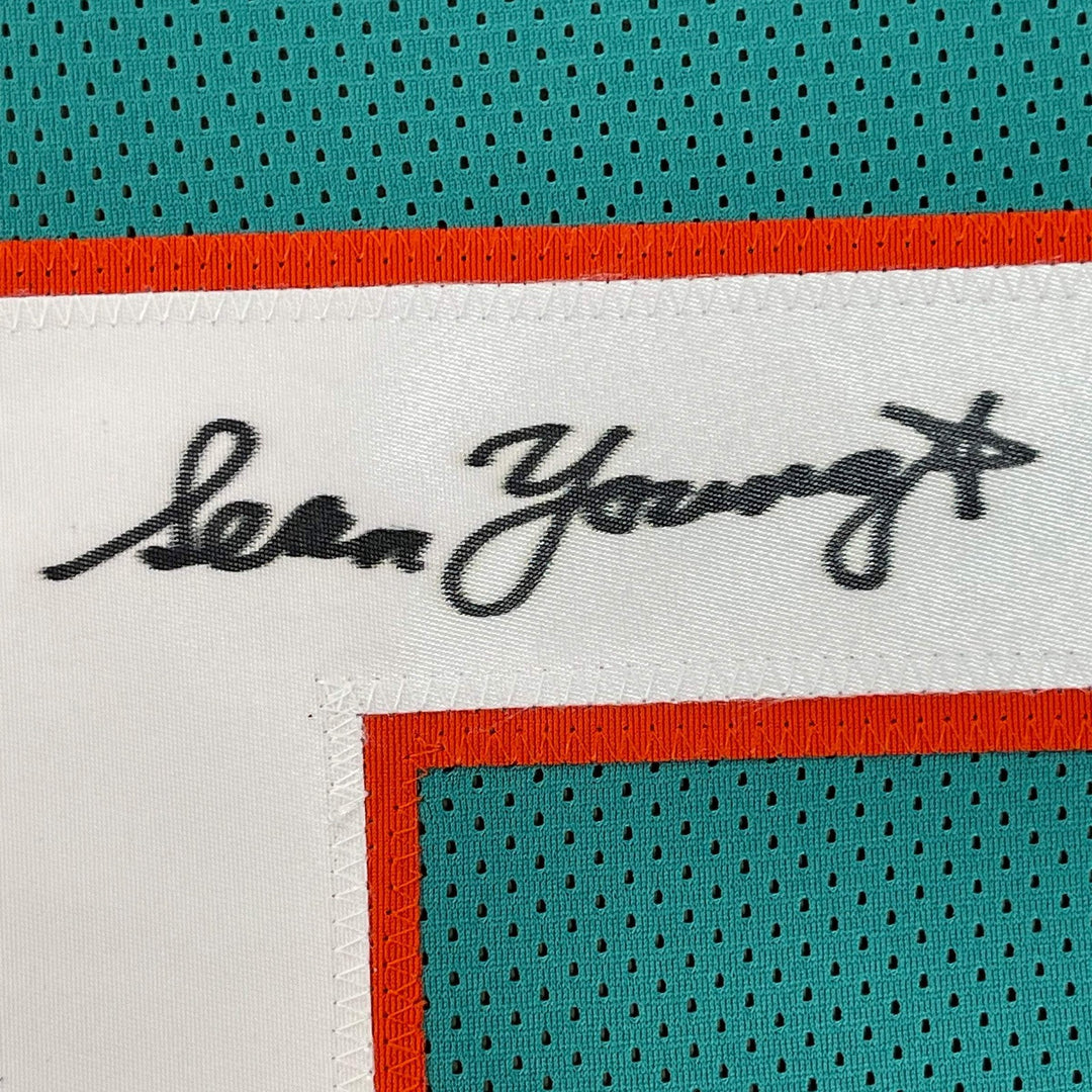 FRAMED Autographed/Signed SEAN YOUNG 33x42 Ray Finkle Miami Teal Jersey PSA COA