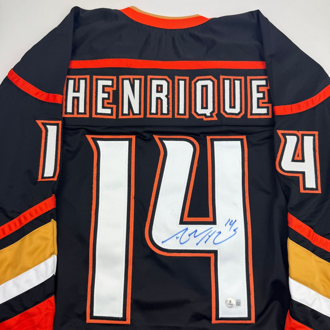 Autographed/Signed Adam Henrique Anaheim Black Hockey Jersey BAS COA