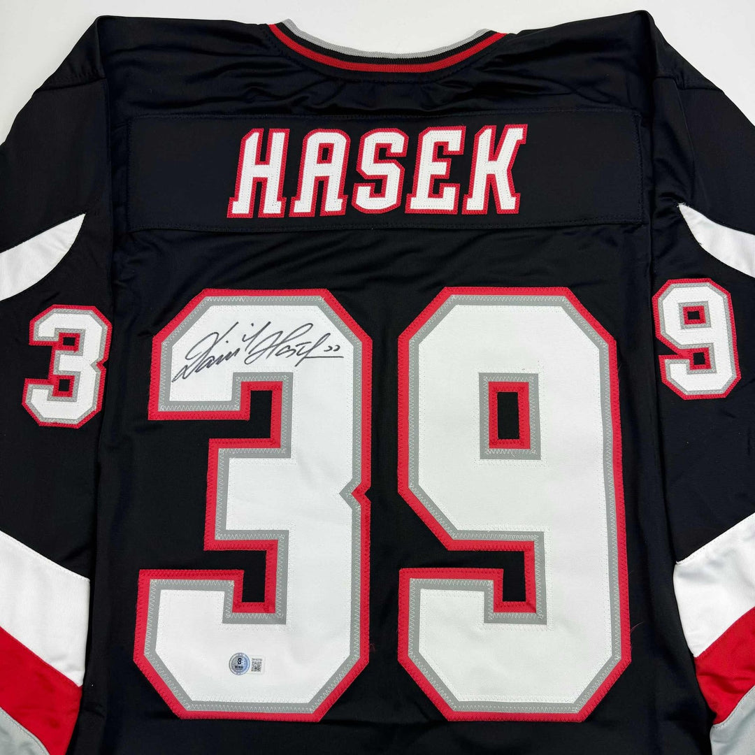 Autographed/Signed Dominik Hasek Buffalo Black Jersey Beckett BAS COA