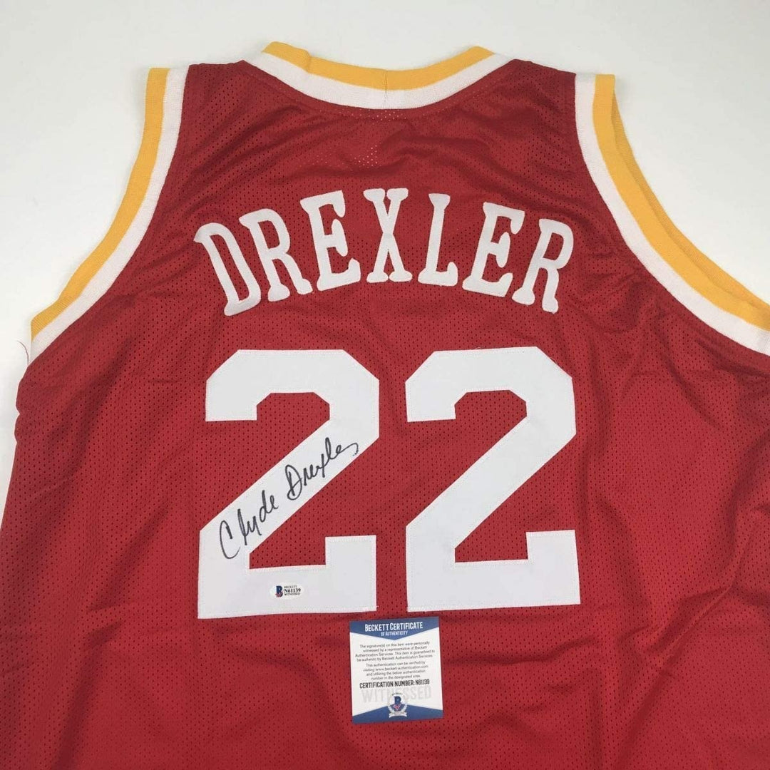 Autographed/Signed Clyde Drexler Houston Red Jersey Beckett BAS COA