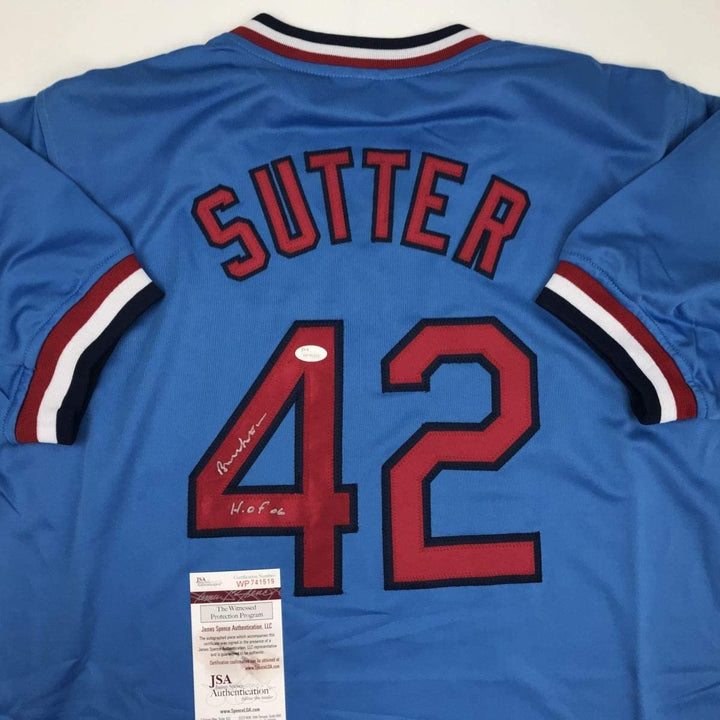 Autographed/Signed Bruce Sutter HOF 06 St. Louis Blue Jersey JSA COA