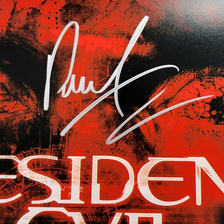 Milla Jovovich & Paul W.S. Anderson signed Resident Evil 12x18 photo (A) ~ BAS