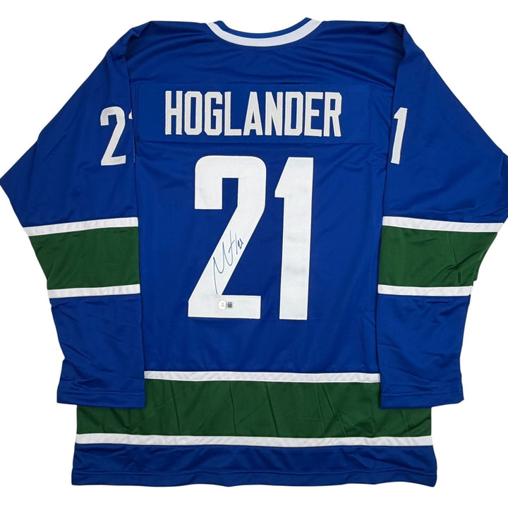 Autographed/Signed Nils Hoglander Vancouver Blue Hockey Jersey Beckett COA