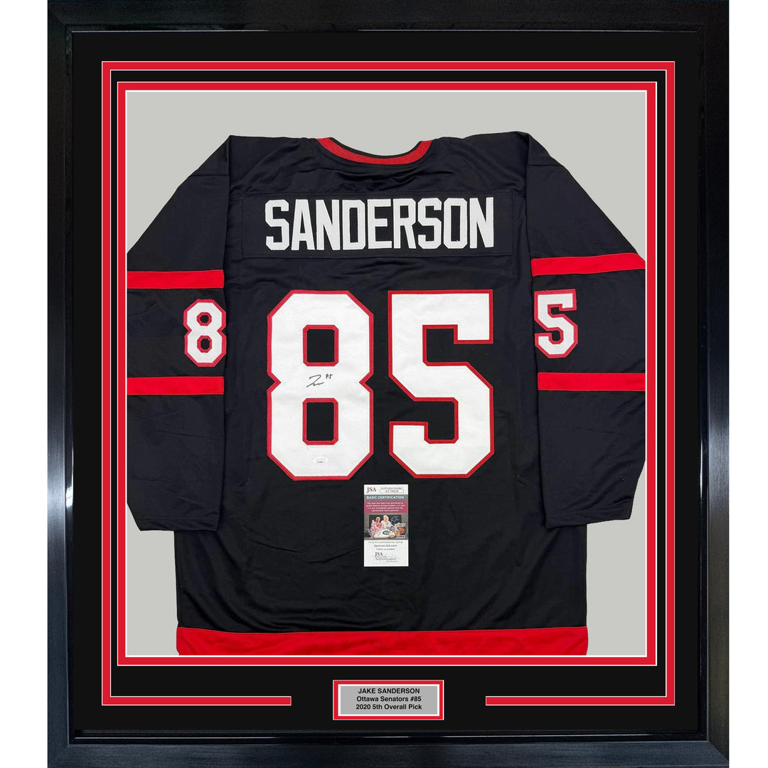 Framed Autographed/Signed Jake Sanderson 35x39 Ottawa Black Jersey JSA COA
