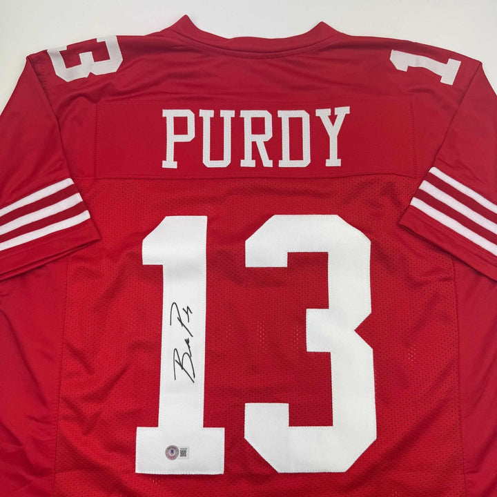 Autographed/Signed Brock Purdy San Francisco Red Jersey Beckett BAS COA