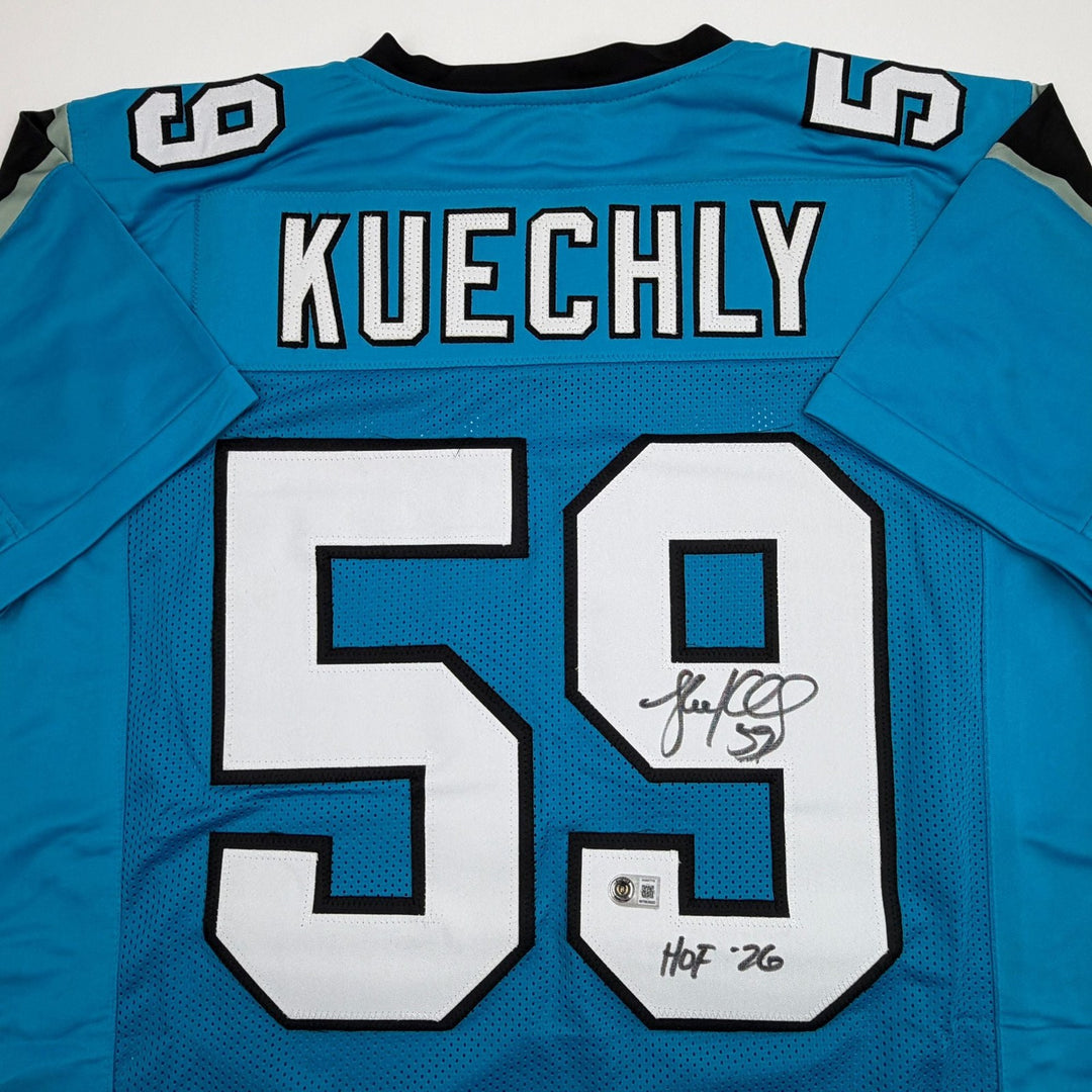 Autographed/Signed Luke Kuechly HOF 26 Carolina Blue Jersey Beckett BAS COA