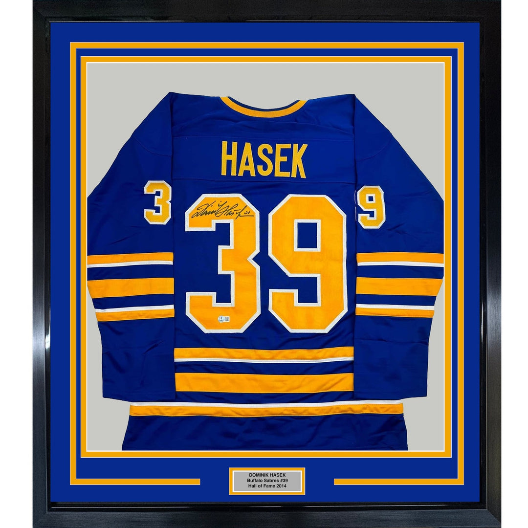 Framed Autographed/Signed Dominik Hasek 35x39 Buffalo Blue Jersey BAS COA