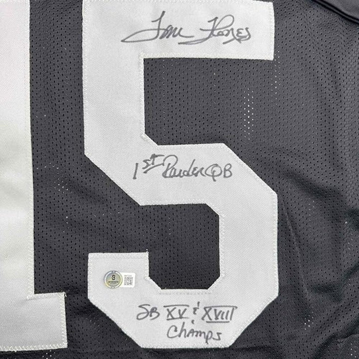 Framed Autographed/Signed Tom Flores 35x39 Oakland Black Jersey Beckett BAS COA