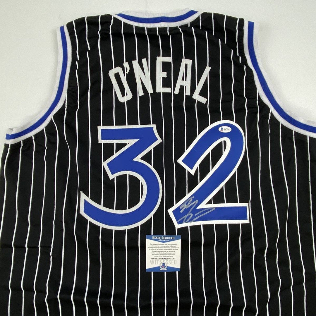 Autographed/Signed SHAQUILLE SHAQ O'NEAL Orlando Black Pinstripe Jersey BAS COA