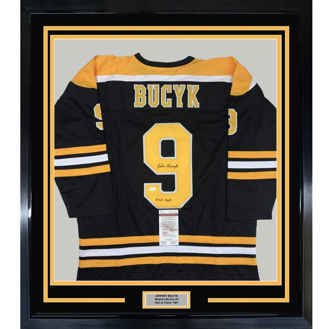 FRAMED Autographed/Signed JOHNNY BUCYK 33x42 Boston Black Jersey JSA COA