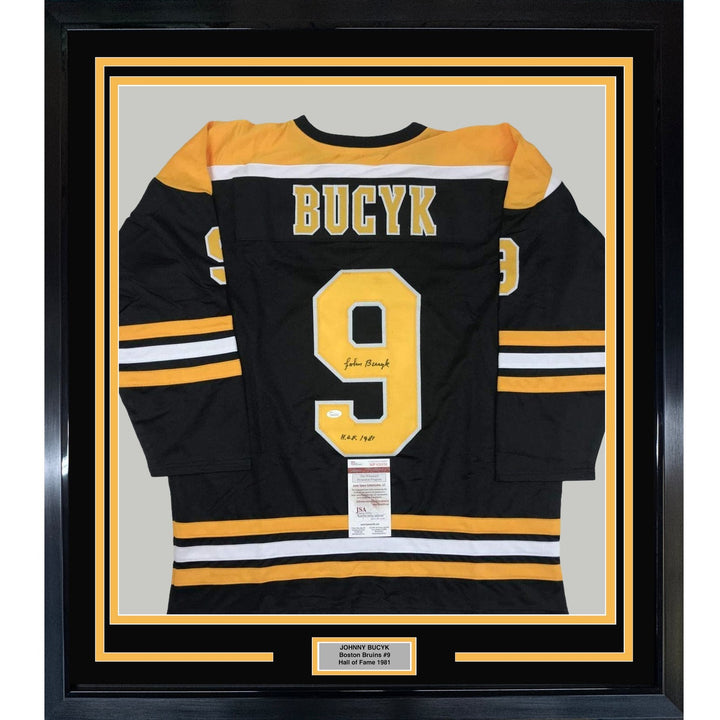 FRAMED Autographed/Signed JOHNNY BUCYK 33x42 Boston Black Jersey JSA COA