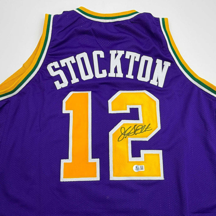 Autographed/Signed John Stockton Utah Purple Jersey Beckett BAS COA