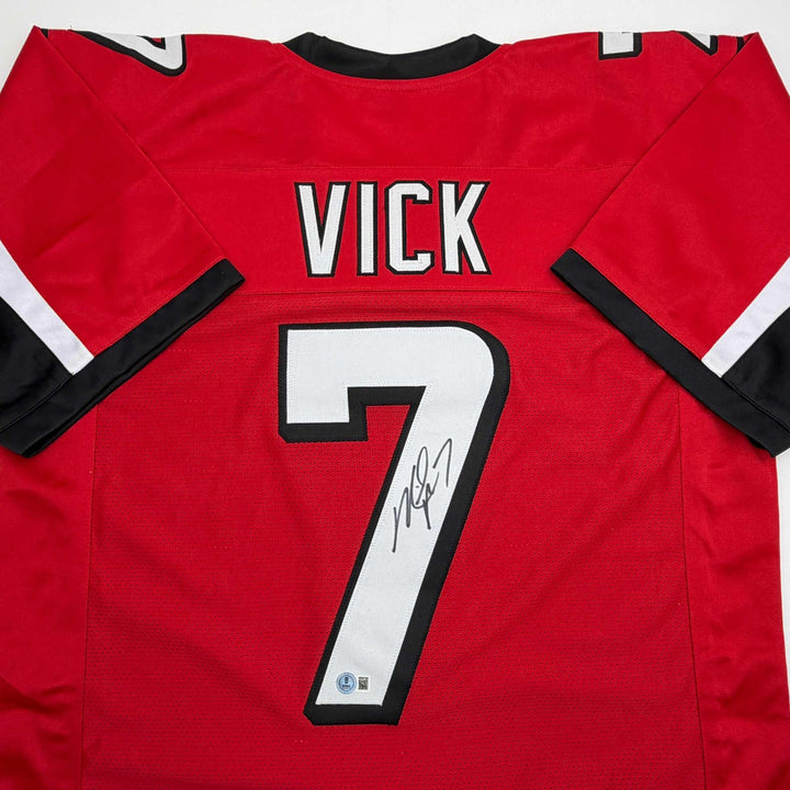 Autographed/Signed MICHAEL MIKE VICK Atlanta Red Football Jersey PSA/DNA COA
