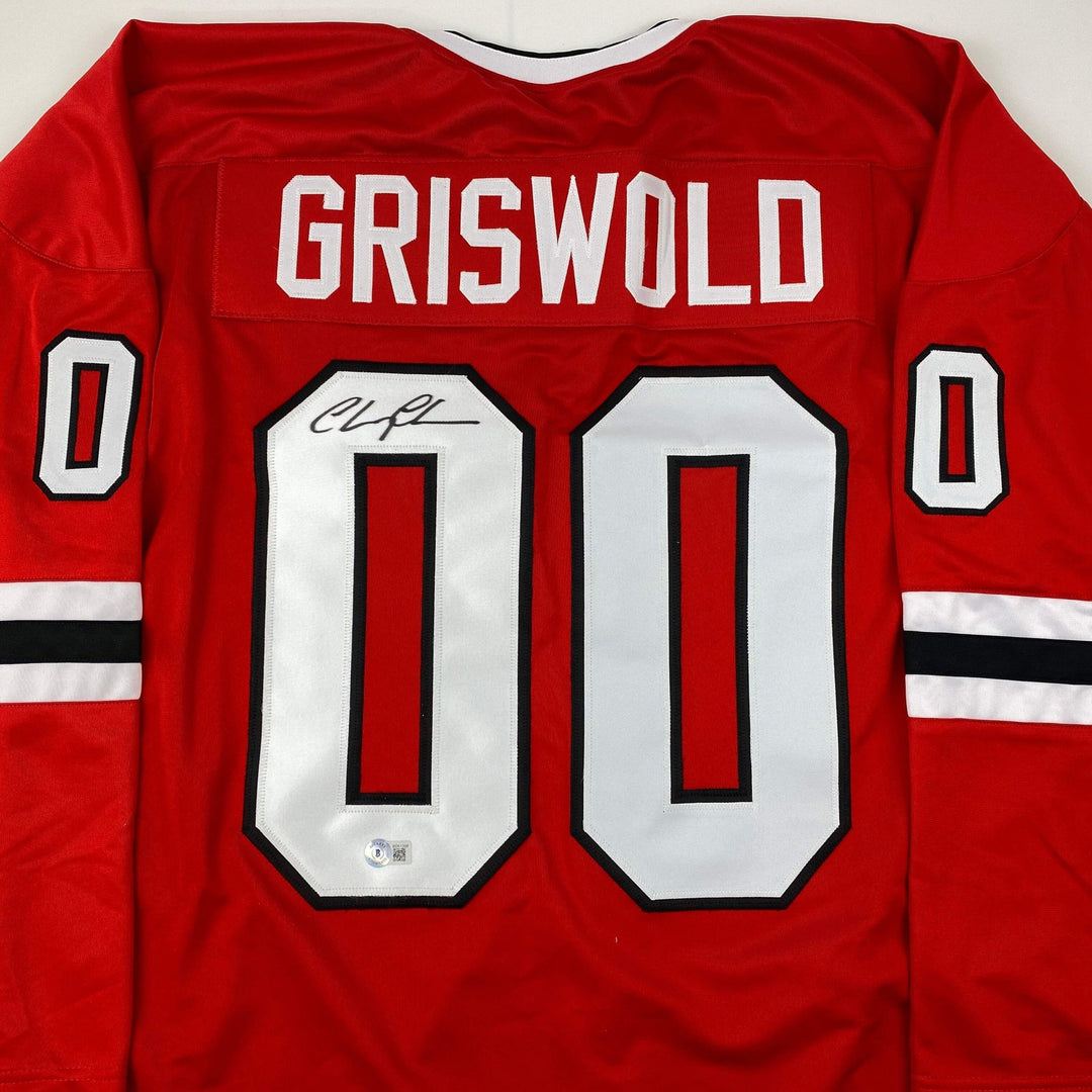 Autographed/Signed Chevy Chase Clark Griswold Vacation Red Jersey Beckett COA