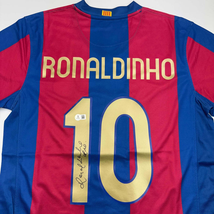 Autographed/Signed Ronaldinho Barcelona Blue/Red Jersey Beckett BAS COA