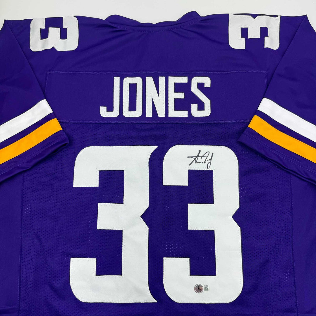 Autographed/Signed Aaron Jones Minnesota Purple Jersey Beckett BAS COA