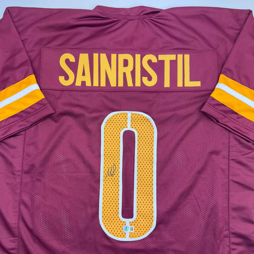 Autographed/Signed Mike Sainristil Washington Burgundy Jersey Beckett BAS COA