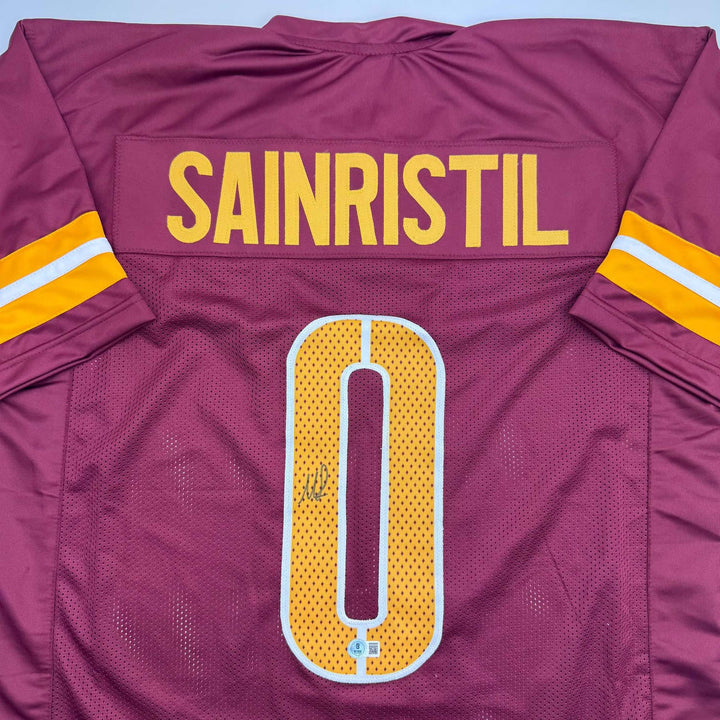 Autographed/Signed Mike Sainristil Washington Burgundy Jersey Beckett BAS COA