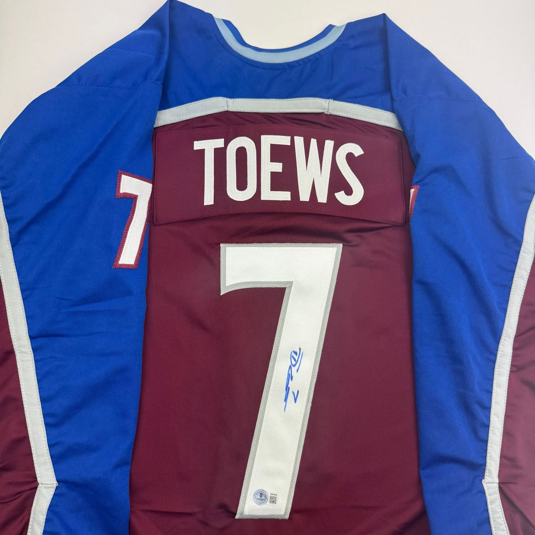 Autographed/Signed Devon Toews Colorado Maroon Jersey Beckett BAS COA